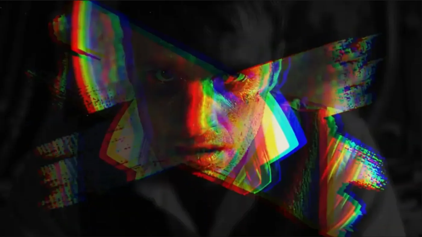 A fractured multicoloured portrait representing a mind caught in spiralling thoughts